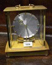 Kundo electric mantel clock, a Bradford exchange composite mantel clock and an oak two train