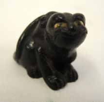 Japanese carved boxwood netsuke in the form of an animal, signed to the base