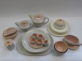 Forty plus pieces of Poole pottery twin tone tea and dinnerware including two teapots etc