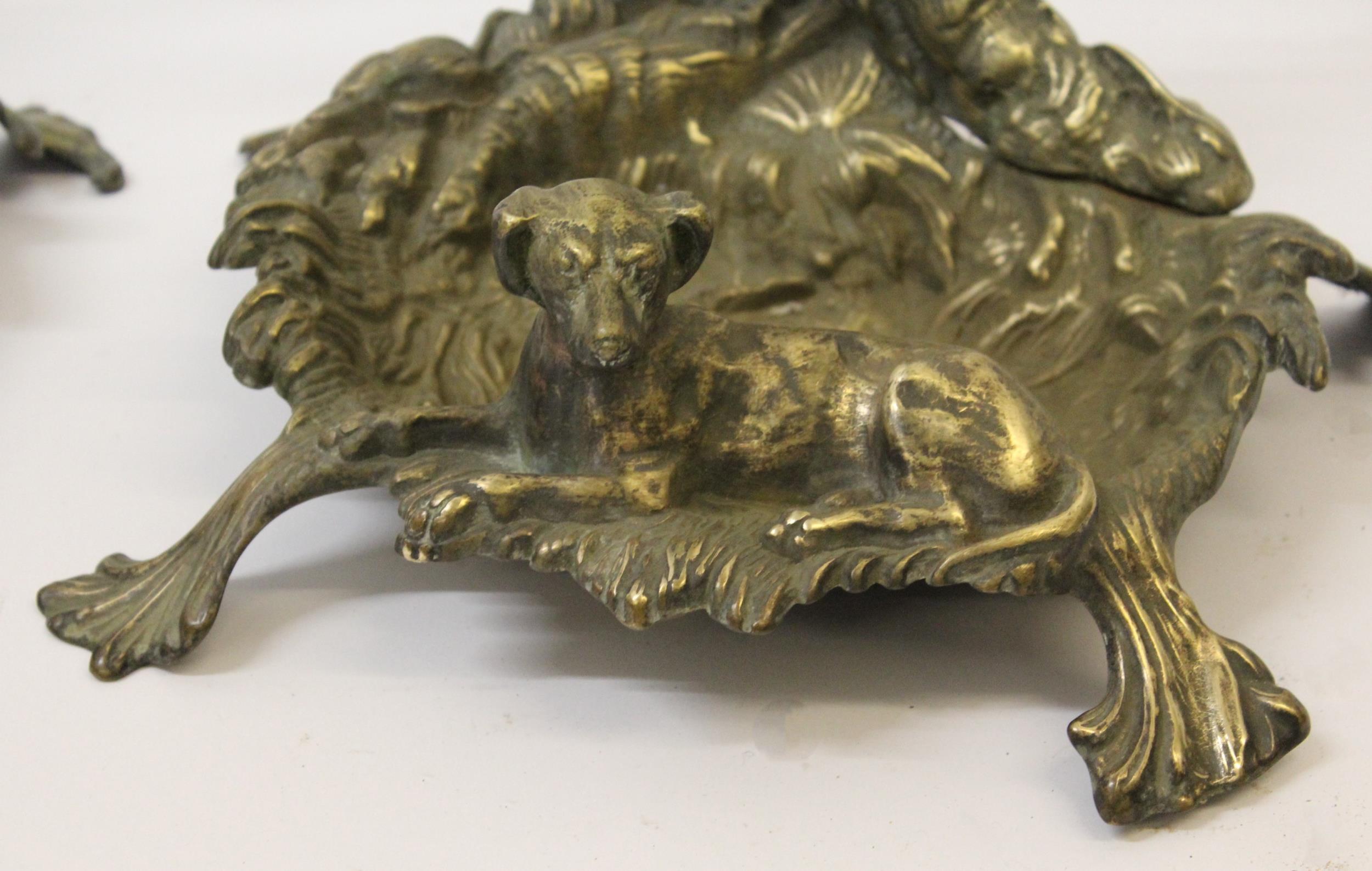 Pair of ornate brass stick stands mounted with figures of dogs, 56cm high - Image 3 of 3