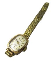 Ladies 9ct gold cased wristwatch on a metal bracelet