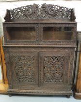 19th Century Indian carved hardwood side cabinet, the pierced gallery top above a pair of glazed