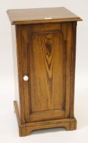 Howard & Sons, late 19th / early 20th Century pitch pine pot cupboard with single panelled door,