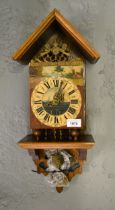 Reproduction Dutch style wall clock with painted dial, together with another Continental wall