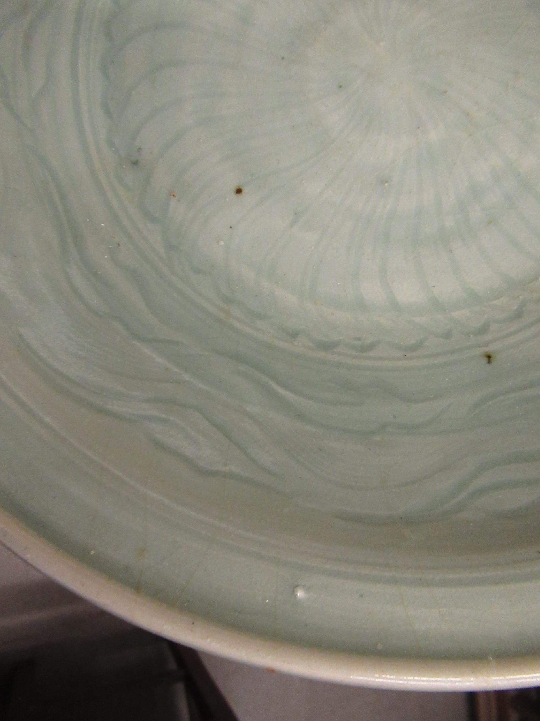 Chinese Celadon circular deep dish with shallow incised decoration, 32cm diameter, with a hardwood - Image 3 of 5