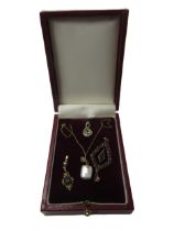 9ct Gold and cultured pearl pendant on chain, two small 9ct gold and gem set pendants and a garnet