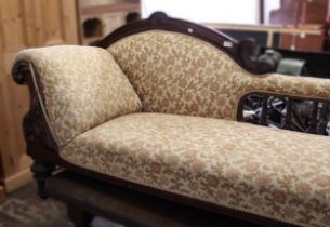 Victorian mahogany chaise longue, the shaped back with spindle uprights above a scroll end and