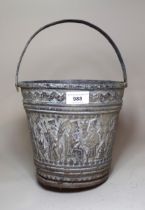 Middle Eastern copper bucket with chased decoration of figures in a continuous band, 18cm high
