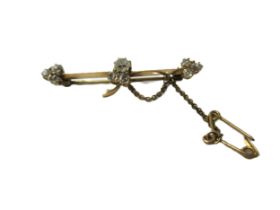 Yellow metal and nine stone old cut diamond set tie pin / bar brooch