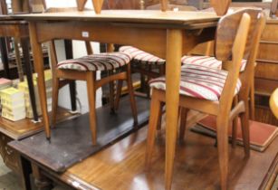 Mid 20th Century teak dining room suite comprising: table, four chairs and a sideboard, the table