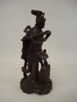 Chinese root carving of an immortal, 27cm high together with a modern oriental hardwood and