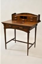 Arts and crafts rosewood writing table, the superstructure with two pigeon holes and five small