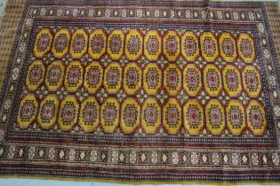 Pakistan carpet of Turkoman design with gold ground, 258 x 168cm