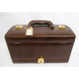 Brown leather vanity case with mirror and fittings to the interior, having jewellery compartment