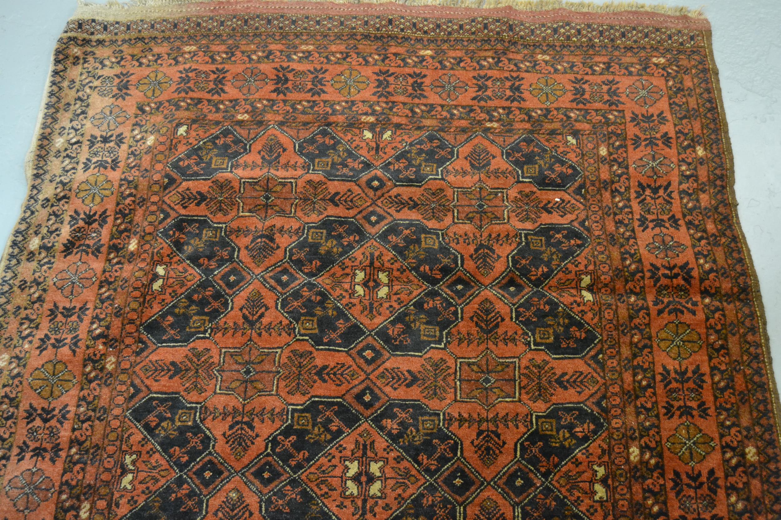 Belouch rug with all over design in shades of madder and black with borders, 185 x 127cm - Image 2 of 3