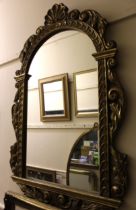 Reproduction gilt framed wall mirror, the arched top with shell and scroll surmount, 130cm high