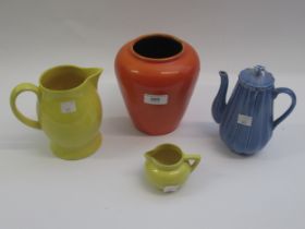 Ashtead potters orange lustre vase, two yellow jugs and a blue glazed coffee pot The two yellow jugs