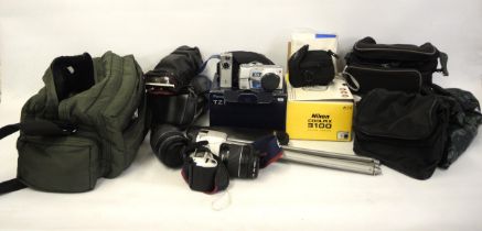 Canon EOS 300 35mm camera, together with a quantity of other cameras and accessories