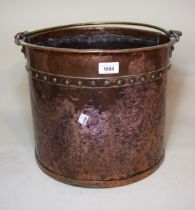 Circular copper and brass mounted coal bucket, together with a circular copper plate embossed with a