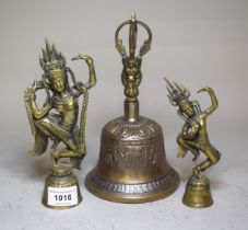 Brass Hindu deity form bell, together with another and a Tibetan bell