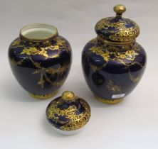 Pair of Royal Crown Derby oviform vases with covers, each with gilt floral decoration on a cobalt