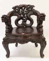 Late 19th / early 20th Century Japanese hardwood tub shaped chair, carved with dragons Good