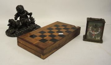 Modern olive wood folding chess board with chess set, a spelter figure of a seated cherub and a