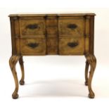 1930's Walnut lowboy in 18th Century style, the inverted breakfront moulded top above two drawers,