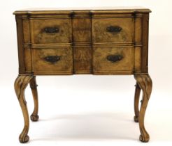 1930's Walnut lowboy in 18th Century style, the inverted breakfront moulded top above two drawers,