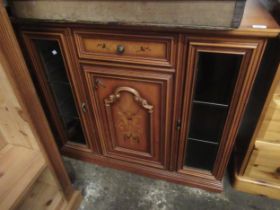 Modern inlaid side cabinet having central door and cupboard flanked by two glazed doors enclosing