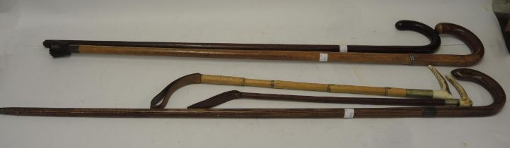 Antique Malacca swordstick, two riding crops with antler handles and two other sticks