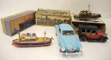 Boxed tin plate model steam ship, together with three other tin plate models and a tin plate biscuit