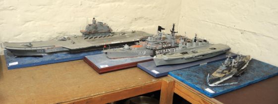 Group of four display models, HMS Belfast, HMS Illustrias, large Soviet aircraft carrier and a