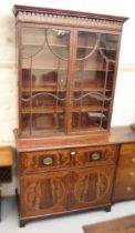 George III mahogany and crossbanded secretaire bookcase, the moulded cornice above two bar glazed