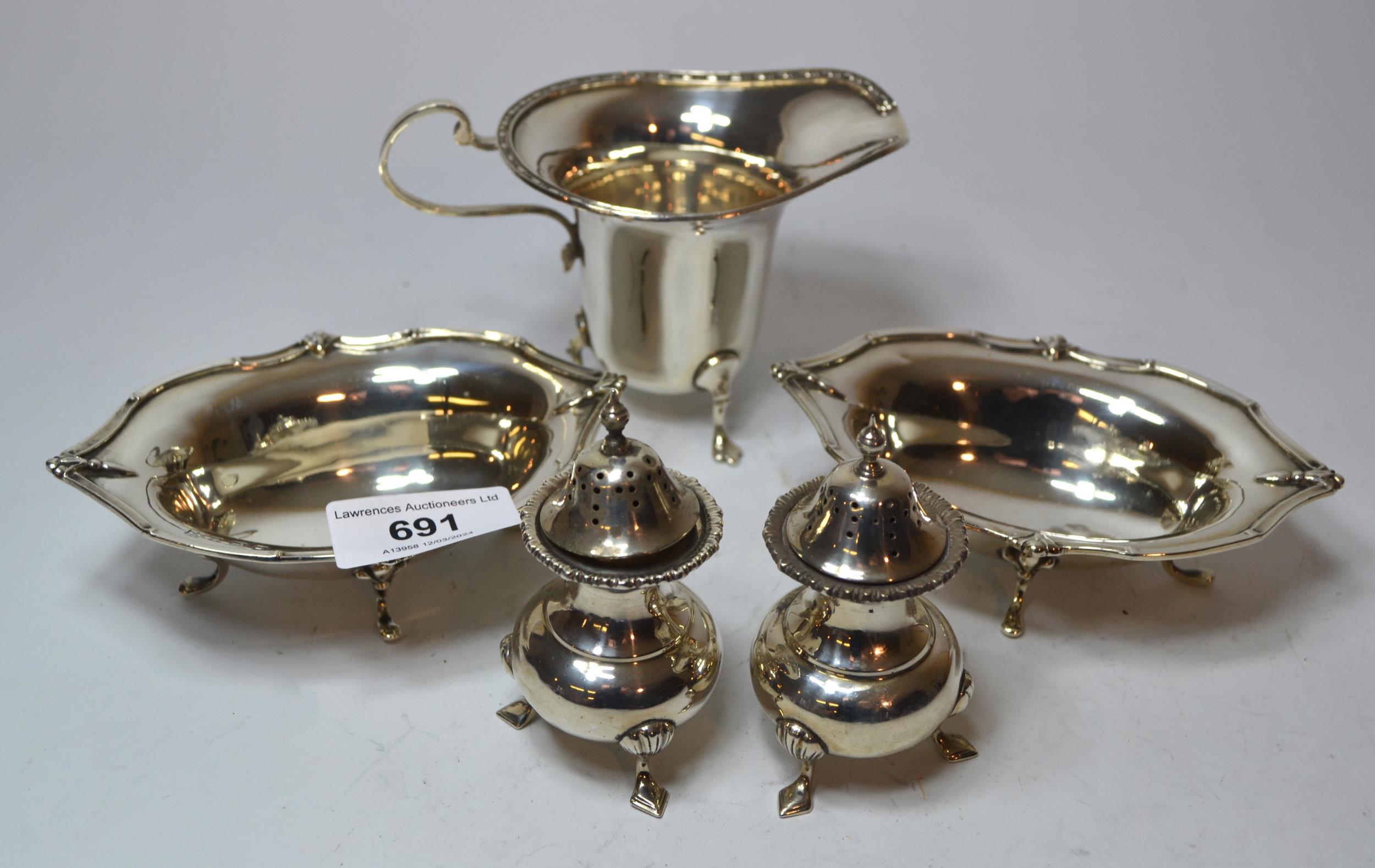 Pair of Birmingham silver oval bonbon dishes, silver cream jug and two silver condiments, 10oz t