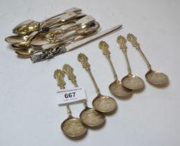 Six Continental white metal ice cream spoons, five coffee spoons, a butter knife, child's knife