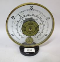 Jaeger circular gilt brass cased barometer / thermometer, 16cm diameter