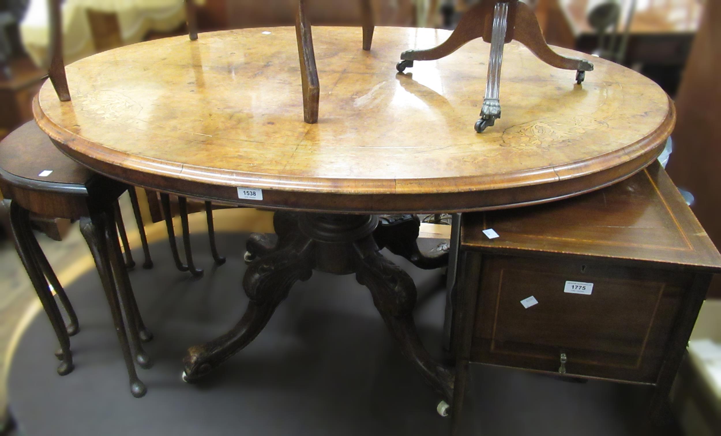 Victorian oval walnut inlaid tilt top pedestal centre table on cabriole supports with castors, 130 x