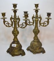 Pair of ornate brass three light candelabra, 42cm high Both are in good condition but are late