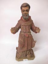 19th Century painted and carved wooden figure of Saint Francis (damage to fingers), 44cm high