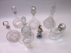 Lladro figure of a boy in dungarees, together with six various glass decanters and a cut glass vase