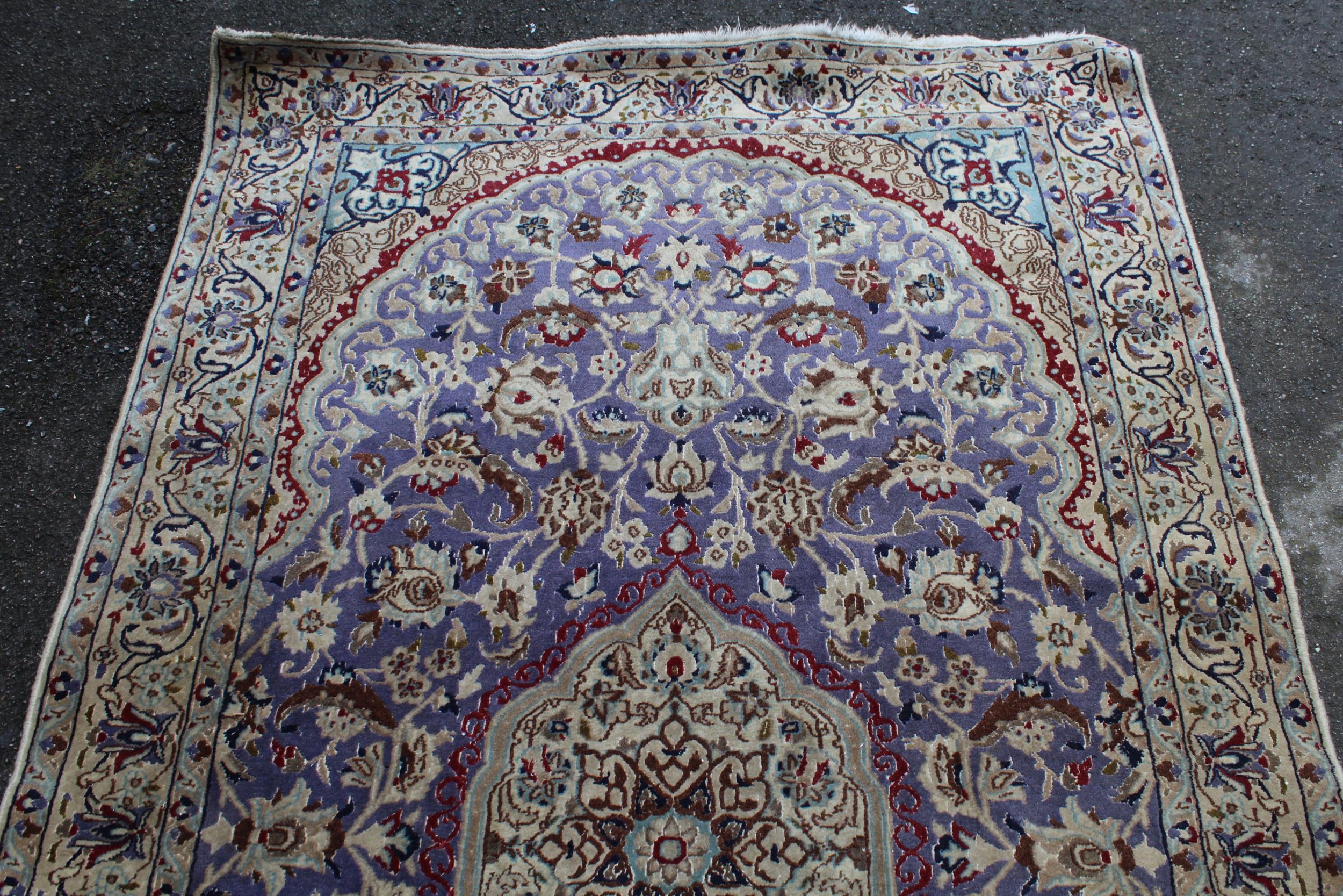 Indo Persian rug with a medallion and all-over palmette design on a mauve ground with borders, 216 x - Image 3 of 4