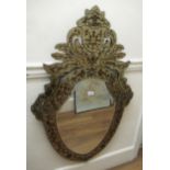 Reproduction Venetian style shield shaped wall mirror with shaped surmount and reverse painted C-