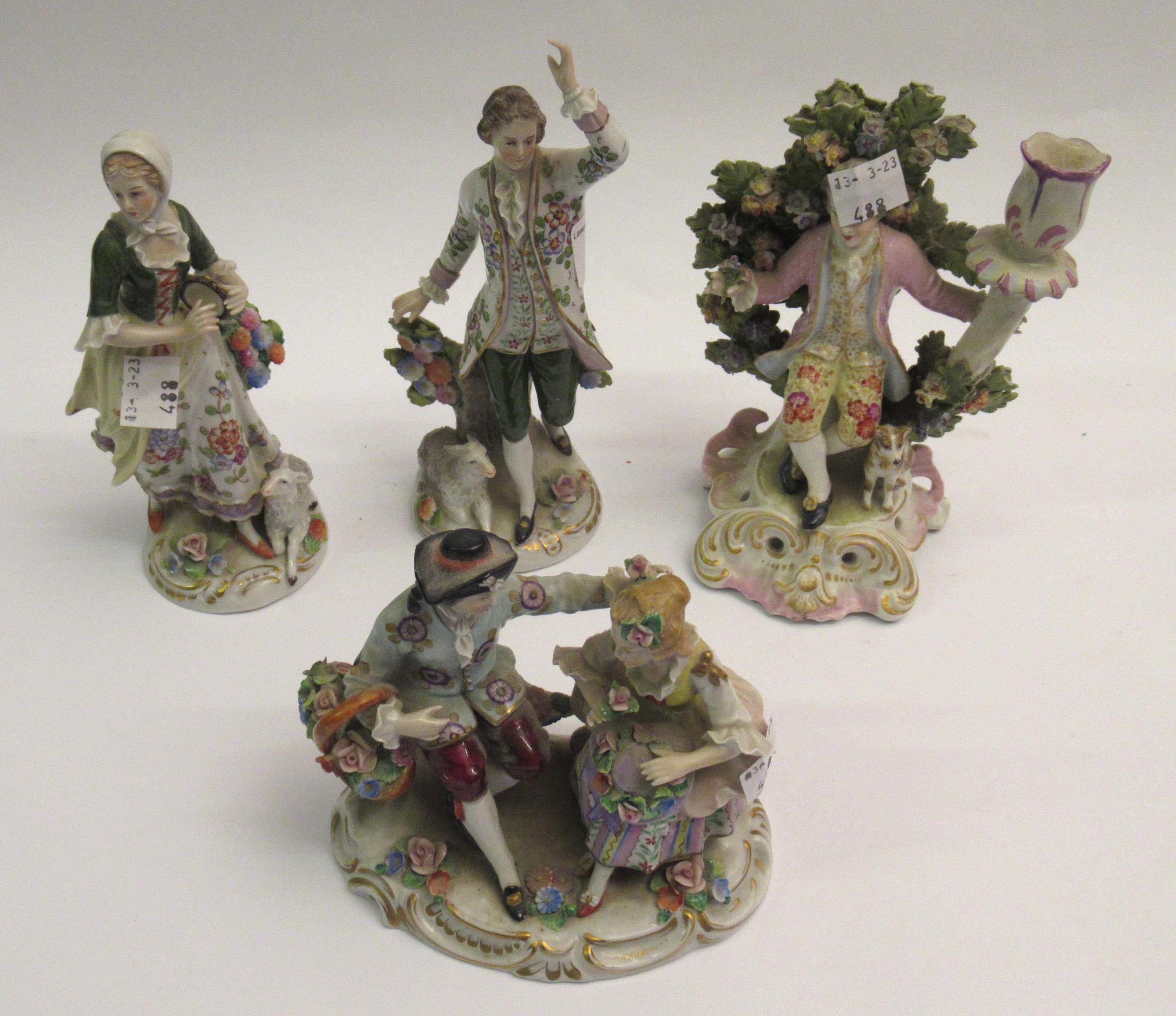 Pair of Sitzendorf figures, the tallest 18cm, together with a Sitzendorf group of a boy and girl and