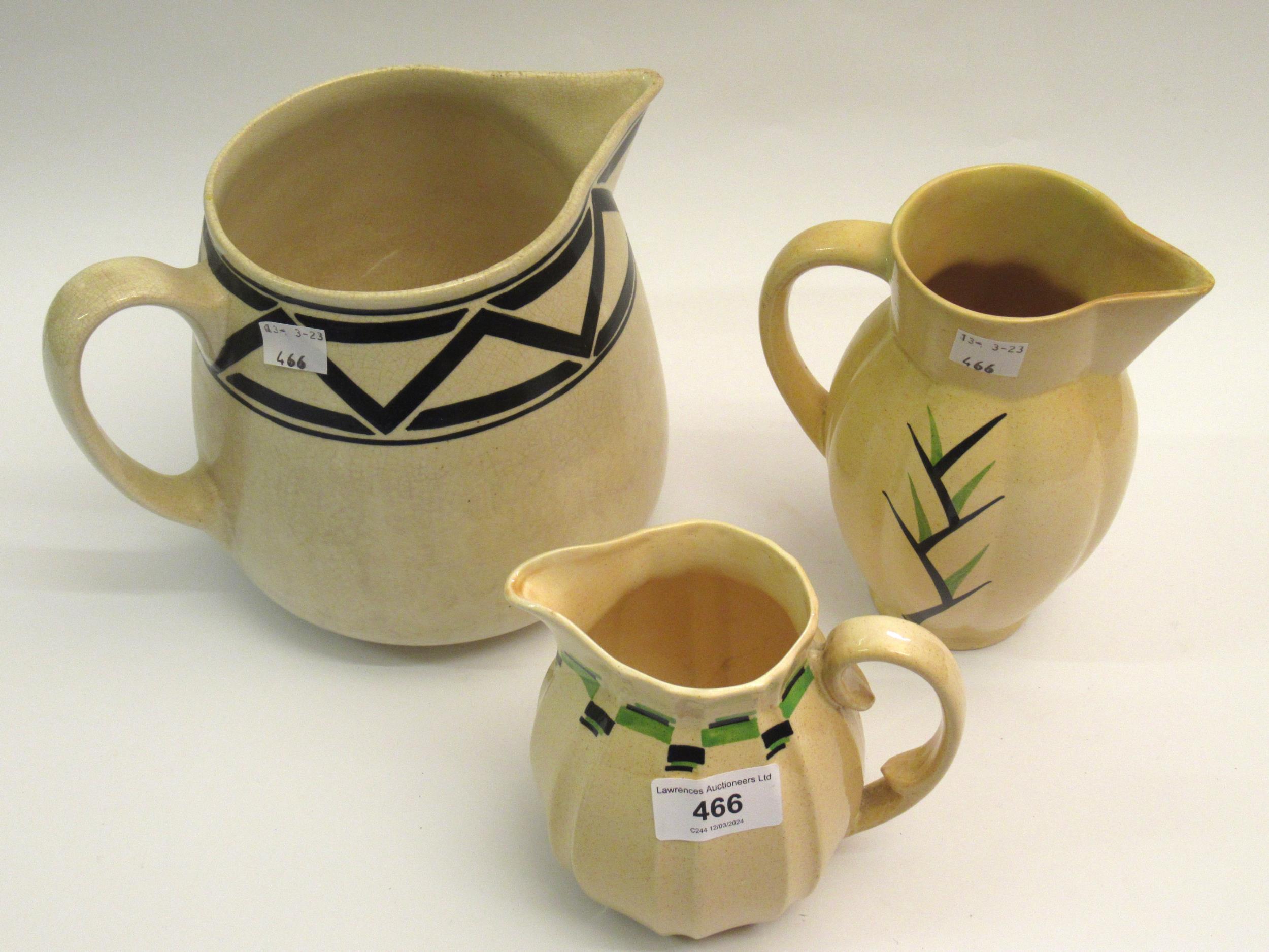 Ashtead Potters group of three jugs, black & green decoration, 13 - 19cm high