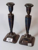 Pair of Birmingham silver candlesticks on square bases, 23cm high (weighted)