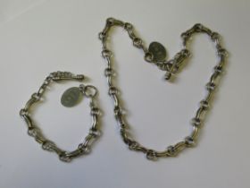 Modern silver necklace and a matching bracelet