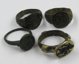 Group of four ancient Roman bronze signet rings