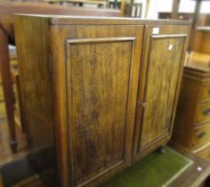 19th Century mahogany two door side cabinet, with shelved interior, on later cabriole supports