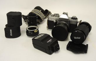 Praktica SLR camera, together with various lenses and a flash gun